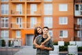 Happy couple or friends hugging on the street after encounter summer Royalty Free Stock Photo