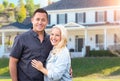 Happy Couple In Front of Beautiful House Royalty Free Stock Photo