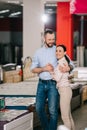 happy couple in furniture store