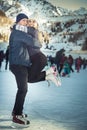 Happy couple, girls and boy ice skating outdoor at rink Royalty Free Stock Photo