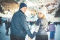 Happy couple, girls and boy ice skating outdoor at rink Royalty Free Stock Photo