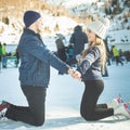 Happy couple, girls and boy ice skating outdoor at rink Royalty Free Stock Photo