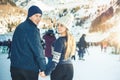 Happy couple, girls and boy ice skating outdoor at rink Royalty Free Stock Photo