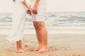 Couple going honeymoon on tropical beach in summer