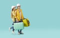 Happy young couple who are going on summer holiday standing on copy space background Royalty Free Stock Photo