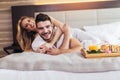 Happy couple having breakfast in luxury hotel room Royalty Free Stock Photo