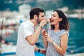 Happy couple having date and eating ice cream on vacation. Royalty Free Stock Photo