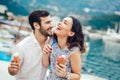 Happy couple having date and eating ice cream on vacation. Royalty Free Stock Photo