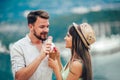 Happy couple having date and eating ice cream on vacation. Royalty Free Stock Photo