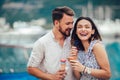 Happy couple having date and eating ice cream on vacation. Royalty Free Stock Photo