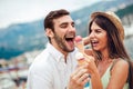 Happy couple having date and eating ice cream on vacation. Royalty Free Stock Photo