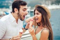 Happy couple having date and eating ice cream on vacation. Royalty Free Stock Photo