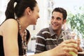 Happy Couple Having Drinks At Sidewalk Cafe Royalty Free Stock Photo