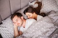 Happy couple having fun in bed. Intimate sensual young couple in bedroom enjoying each other