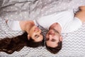 Happy couple having fun in bed.Young couple in bedroom enjoying each other.