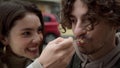 Happy couple having fun on city street. Cheerful pair fooling on date outdoor. Royalty Free Stock Photo