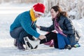 Happy couple having fun ice skating on rink outdoors. Royalty Free Stock Photo