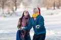 Happy couple having fun ice skating on rink outdoors. Royalty Free Stock Photo