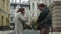 Happy couple having fun outdoor. Man and woman spending time together on street. Royalty Free Stock Photo