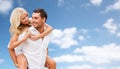 Happy couple having fun over blue sky background Royalty Free Stock Photo