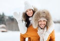 Happy couple having fun over winter background Royalty Free Stock Photo