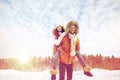 Happy couple having fun over winter background Royalty Free Stock Photo