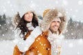 Happy couple having fun over winter background Royalty Free Stock Photo