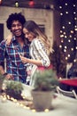 Happy couple having fun with props on stick in nightclub celebrating. Party, Celebration, love, socializing concept