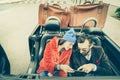 Happy couple having fun with satnav at car travel