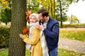 Happy Couple having fun together Outdoor in the golden autumn park, looking at eachother and smiling. Wife and husband in love. Royalty Free Stock Photo