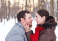 Happy couple having fun in the winter park Royalty Free Stock Photo