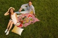 Happy couple having picnic in park on sunny day Royalty Free Stock Photo