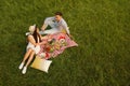 Happy couple having picnic in park on sunny day Royalty Free Stock Photo