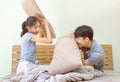 Couple having pillow fight on bed Royalty Free Stock Photo