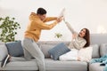 Happy couple having pillow fight in room Royalty Free Stock Photo