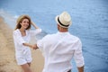 Happy couple having romantic walk on beach Royalty Free Stock Photo