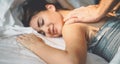 Happy couple having tender moments in the bed - Young romantic lovers intimate massaging and cuddling in the bedroom