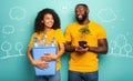 Happy couple hold a plastic container with bottles and a small tree over a light blue color. Concept of ecology Royalty Free Stock Photo