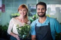 Happy couple holding flower bouquet Royalty Free Stock Photo