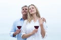 Happy couple holding a glass of red wine Royalty Free Stock Photo