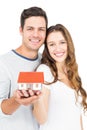 Happy couple holding miniature house Royalty Free Stock Photo