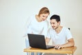 Happy couple at home paying bills with laptop Royalty Free Stock Photo