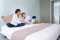 Happy couple in hotel room watching tablet computer Royalty Free Stock Photo