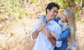 Happy couple, hug and nature for love, support or affection in outdoor walk or bonding. Young woman and man smile in Royalty Free Stock Photo