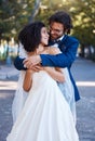 Happy couple, hug and wedding celebration event outdoor with love, care and commitment. Interracial man and woman at Royalty Free Stock Photo