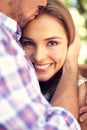 Happy couple, hug woman and portrait in park closeup on valentines date, love and romance with smile. Man, kiss and Royalty Free Stock Photo