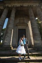 Happy couple hugging on background beautiful columns