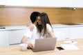 Love couple using laptop. Computer at home, woman hugging man, smiling Royalty Free Stock Photo