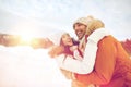 Happy couple hugging outdoors in winter Royalty Free Stock Photo