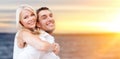 Happy couple hugging over sea background Royalty Free Stock Photo